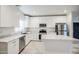 Beautiful kitchen featuring stainless steel appliances, white cabinets, and island with marble countertop at 5230 E Pony Track Ln, San Tan Valley, AZ 85140