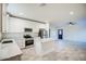 Stylish kitchen with stainless steel appliances, white cabinets, and island with marble countertop at 5230 E Pony Track Ln, San Tan Valley, AZ 85140