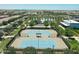Aerial view of community tennis courts surrounded by lush landscaping and community amenities at 5515 S Caisson Way, Mesa, AZ 85212