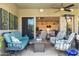 Comfortable seating on a back patio offering views to an open-concept living space at 5515 S Caisson Way, Mesa, AZ 85212
