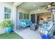 Relaxing back patio with plush sofa, chairs, and a view of the open-concept interior at 5515 S Caisson Way, Mesa, AZ 85212