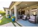 Inviting back patio with comfortable seating and a ceiling fan for outdoor relaxation at 5515 S Caisson Way, Mesa, AZ 85212