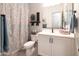 Well-appointed bathroom features stylish decor, a full vanity, and a coordinated color scheme at 5515 S Caisson Way, Mesa, AZ 85212