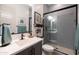 Modern bathroom featuring a sleek vanity, framed mirror, and glass-enclosed shower at 5515 S Caisson Way, Mesa, AZ 85212