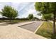 Well-manicured bocce ball court surrounded by lush greenery, providing recreational space for outdoor enjoyment at 5515 S Caisson Way, Mesa, AZ 85212