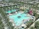 The aerial view shows a large community pool with water slides and palm trees surrounded by neighborhood homes at 5515 S Caisson Way, Mesa, AZ 85212