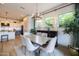 Charming dining room with natural light, modern chandelier, and view of the kitchen at 5515 S Caisson Way, Mesa, AZ 85212