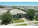Stunning single-story home with stone details, desert landscaping, and lush green trees, set in a peaceful neighborhood at 5515 S Caisson Way, Mesa, AZ 85212