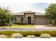 Charming single-story home featuring desert landscaping and a two-car garage at 5515 S Caisson Way, Mesa, AZ 85212