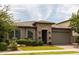 Charming single-story home featuring desert landscaping and a two-car garage at 5515 S Caisson Way, Mesa, AZ 85212