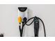 Level 2 EV charger for an electric vehicle inside of a home garage at 5515 S Caisson Way, Mesa, AZ 85212