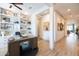 Well-lit home office with custom built-ins provides a perfect space for work and productivity at 5515 S Caisson Way, Mesa, AZ 85212