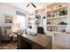 Spacious home office with custom built-ins, perfect for focusing on all of your business needs at 5515 S Caisson Way, Mesa, AZ 85212