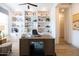 Inviting home office with custom shelving, perfect for remote work and organized productivity at 5515 S Caisson Way, Mesa, AZ 85212