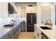 Modern Kitchen with stainless steel appliances, gray lower cabinets and white upper cabinets at 5515 S Caisson Way, Mesa, AZ 85212