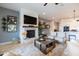 Inviting living room with a cozy fireplace, comfortable seating, and easy access to the kitchen at 5515 S Caisson Way, Mesa, AZ 85212