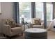 Cozy seating area in the main bedroom features comfortable chairs and a large window at 5515 S Caisson Way, Mesa, AZ 85212