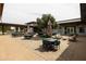 Inviting patio with ample seating, perfect for outdoor dining and relaxation in a modern architectural setting at 5515 S Caisson Way, Mesa, AZ 85212