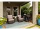 Cozy covered patio with comfortable seating, perfect for relaxing and enjoying the outdoors with a grill at 5515 S Caisson Way, Mesa, AZ 85212