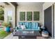 Cozy covered patio with contemporary decor and fire pit table at 5515 S Caisson Way, Mesa, AZ 85212