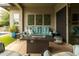 Comfortable outdoor patio area with a cozy couch, fire pit, and stylish decor, perfect for relaxation at 5515 S Caisson Way, Mesa, AZ 85212