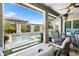 Inviting covered patio with cozy seating area and views of the pool at 5515 S Caisson Way, Mesa, AZ 85212
