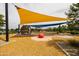 Vibrant community playground with colorful shade canopies and unique play structures at 5515 S Caisson Way, Mesa, AZ 85212