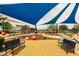 Well-equipped community playground featuring shade structures, benches, and soft ground cover at 5515 S Caisson Way, Mesa, AZ 85212