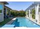 Inviting pool with water features set against lush greenery and a decorative pergola at 5515 S Caisson Way, Mesa, AZ 85212