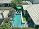 Aerial view of a private pool area, featuring lounge chairs and colorful flowerbeds at 5515 S Caisson Way, Mesa, AZ 85212