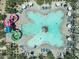 Overhead shot of the community pool showcasing splash pad, slides, and plenty of lounge chairs at 5515 S Caisson Way, Mesa, AZ 85212