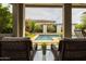 Inviting outdoor space with a sparkling pool and lush landscaping, perfect for relaxation and entertaining at 5515 S Caisson Way, Mesa, AZ 85212