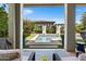 View of the stunning pool and backyard from the covered patio seating area at 5515 S Caisson Way, Mesa, AZ 85212