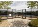 A well-maintained tennis court is surrounded by a secure fence, offering a private and professional playing experience at 5515 S Caisson Way, Mesa, AZ 85212