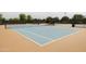 Well-maintained community tennis courts with blue surface and white lines at 5515 S Caisson Way, Mesa, AZ 85212