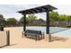 Community tennis court featuring a black bench and trellis at 5515 S Caisson Way, Mesa, AZ 85212