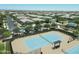 Overhead view of tennis courts with blue surface and well-maintained surrounding landscaping at 5515 S Caisson Way, Mesa, AZ 85212