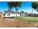 Expansive backyard with lush grass, mature trees, and a well-maintained lawn at 640 S 34Th St, Mesa, AZ 85204