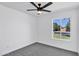 Minimalist bedroom with ceiling fan, plush carpet and a window offering natural light at 640 S 34Th St, Mesa, AZ 85204