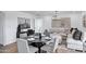 Inviting living area featuring a dining table, comfortable seating, modern decor, and stylish lighting at 640 S 34Th St, Mesa, AZ 85204