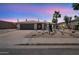 Charming single-story home with desert landscaping, two-car garage, and inviting entrance at 6620 E Paradise Ln, Scottsdale, AZ 85254