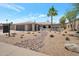 Charming single-story home featuring a xeriscaped front yard, complemented by a desert-friendly aesthetic at 6620 E Paradise Ln, Scottsdale, AZ 85254
