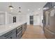 Modern kitchen with an island and stainless steel refrigerator at 6620 E Paradise Ln, Scottsdale, AZ 85254