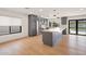 Open concept kitchen featuring granite countertops, a kitchen island, and stainless steel appliances at 6620 E Paradise Ln, Scottsdale, AZ 85254