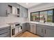 Beautiful kitchen featuring stainless steel appliances, granite countertops, and ample natural light at 6620 E Paradise Ln, Scottsdale, AZ 85254