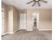The bedroom offers plush carpeting, a bright window, a ceiling fan, and access to a closet at 6805 S Sapphire Way, Chandler, AZ 85249