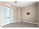 Carpeted bedroom with frosted glass doors and a wall mount TV bracket at 6805 S Sapphire Way, Chandler, AZ 85249