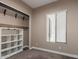 Bedroom with carpet, window with blinds, and a closet with organizers at 6805 S Sapphire Way, Chandler, AZ 85249
