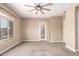 Spacious bedroom boasts plush carpeting, a stylish ceiling fan, and a bright window at 6805 S Sapphire Way, Chandler, AZ 85249