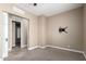 Bedroom featuring neutral walls, carpet, and closet with sliding door at 6805 S Sapphire Way, Chandler, AZ 85249